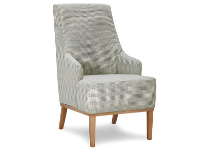 Designstol i tyg och läder för en person i TV-rummet