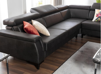 Svart L-formad soffa med sängfunktion