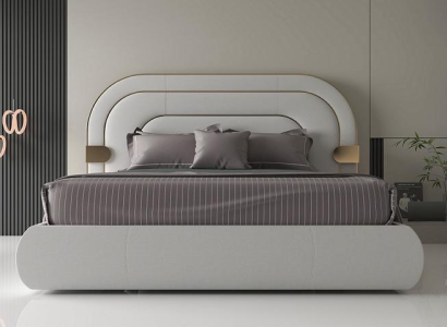 Lyxig grå sängram med gyllene detaljer i modern design och mjukt stoppning