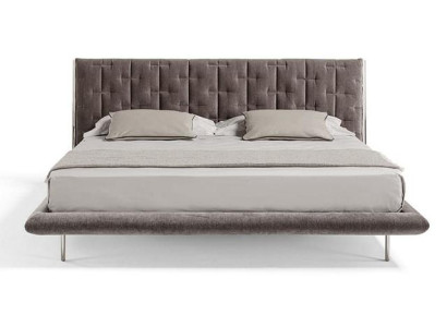 Modern grå klädd säng