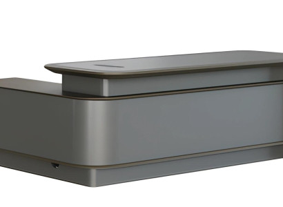 Modern grå skrivbord med förvaring och kabelhantering