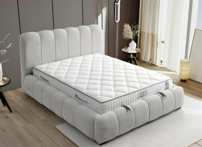 Säng i modern vit tyg med kvalitetsmadrass