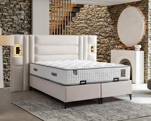 Elegant vit säng med klädsel och madrass av trä