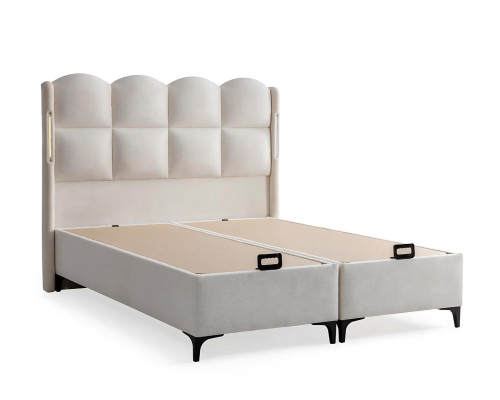 Elegant vit säng med modern madrass