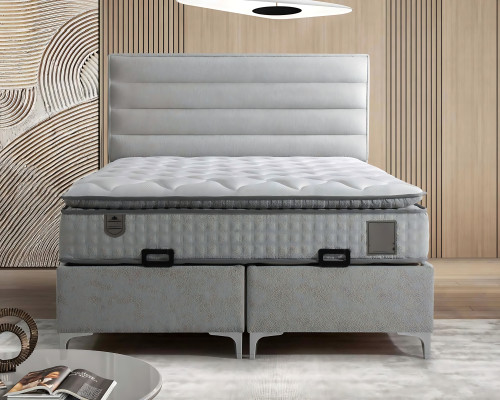 Säng i modern grå tyg med elegant madrass