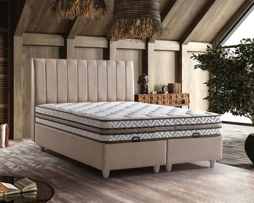 Säng i beige tyg med elegant madrass