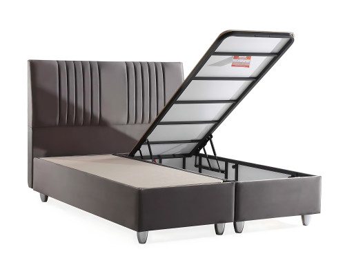 Säng i grått tyg med modern madrass