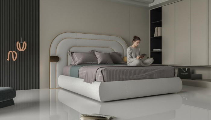 Lyxig grå sängram med gyllene detaljer i modern design och mjukt stoppning