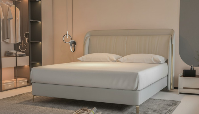 Säng modern lyx med elegant guldhuvud i grått