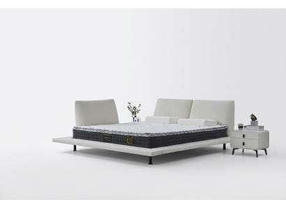 Set av minimalistisk vit sängram med huvudgavel