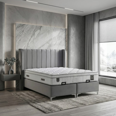 Elegant säng av tyg och trä med madrass